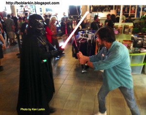 Bob Larkin battles Darth Vader in the dealers room. Photo by Ken Larkin.